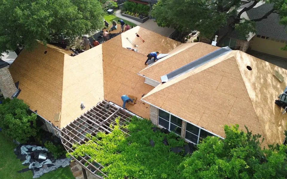 Aerial view of one of our jobs with the old roof torn off down to bare decking